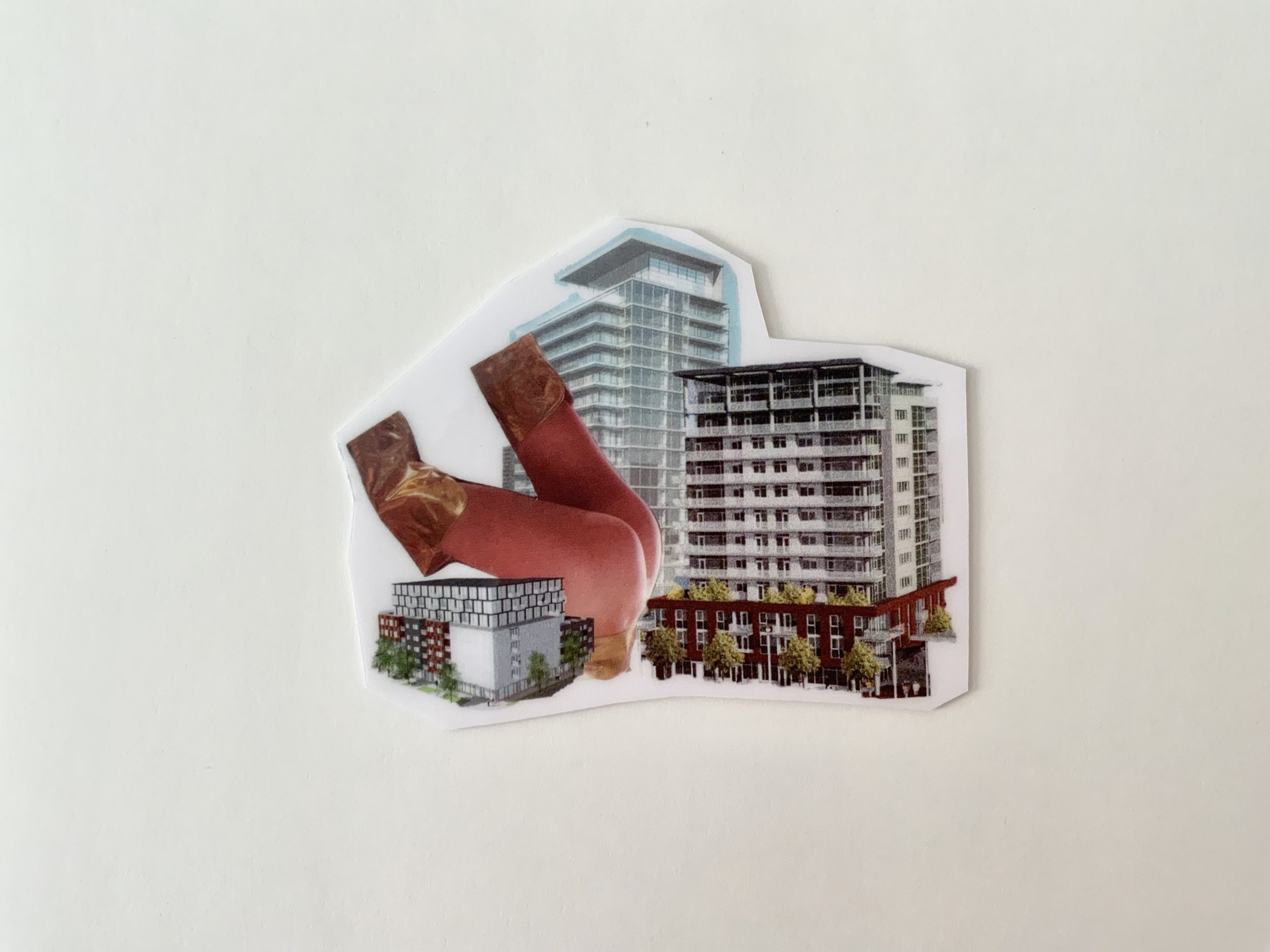Photo of a cutout collage artwork by Arjun Lal on a white background. The artwork features legs and condo buildings.