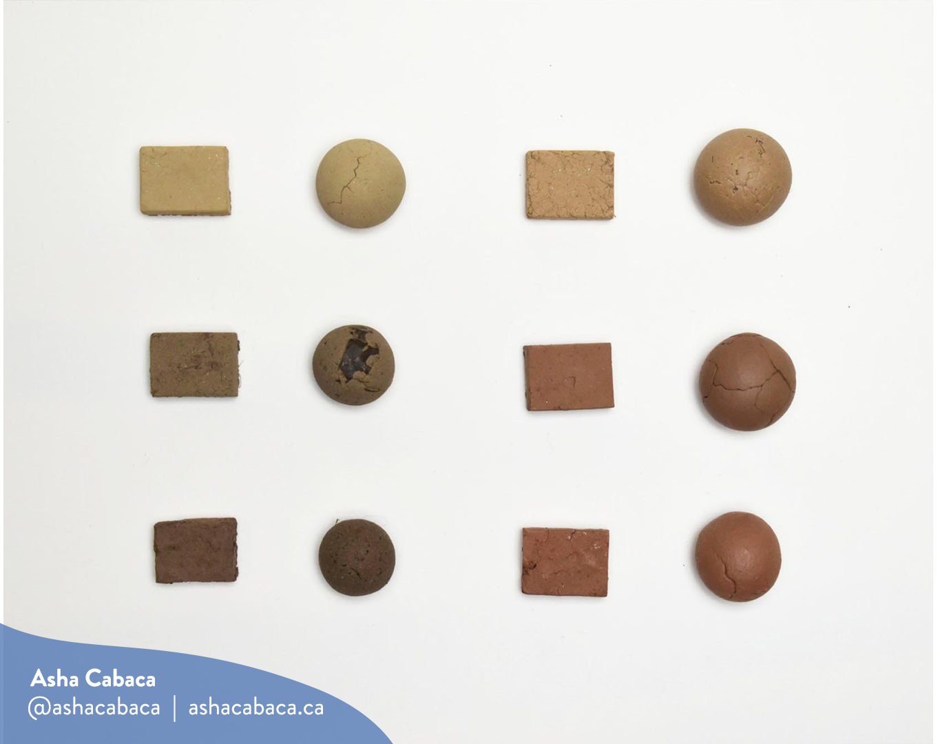 Horizontal photo of artwork by Asha Cabaca, it features six kinds of mud rolled into a sphere and into rectangles on a white surface. There is a watermark in blue that has Asha’s name, Instagram handle (@ashacabaca) and website (ashacabaca.ca).