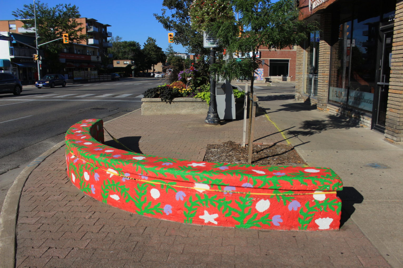 Public seating area in Port Credit is painted by artist Erin McCluskey