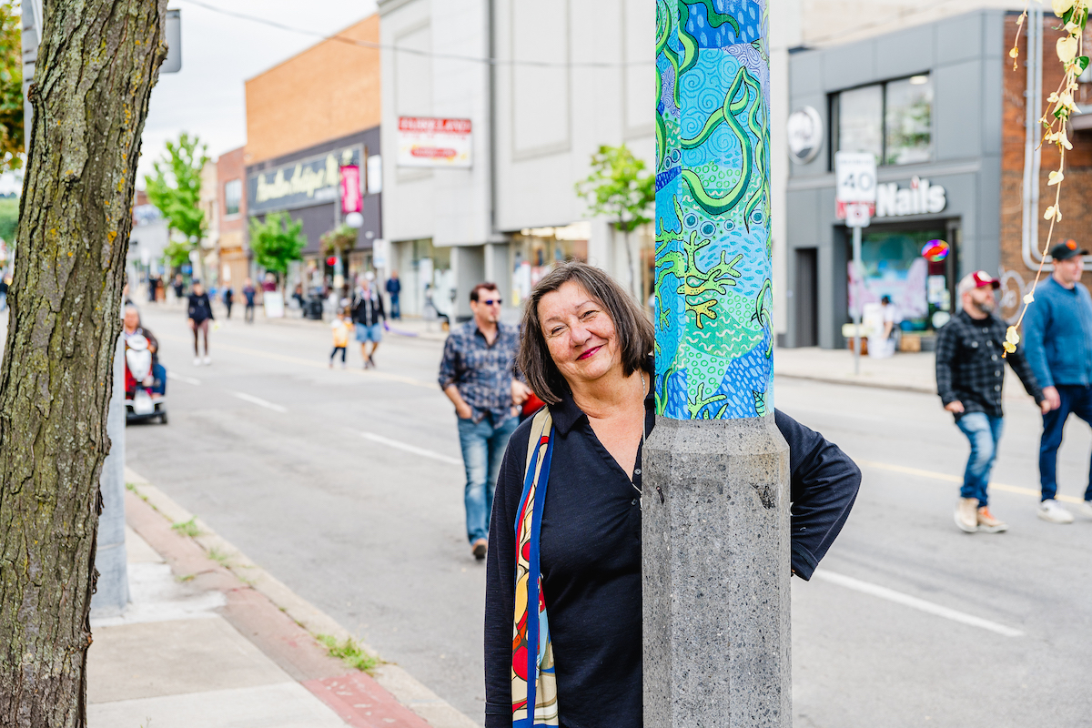 Artist Sharon Trottier with street poles in Hamilton are animated with vinyl wraps