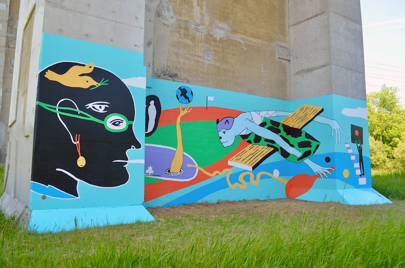 A turquoise mural on the Panam Path by Z'otz* Collective with figurative illustrations of animals, people, and sports