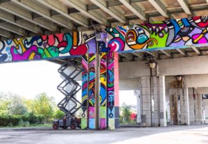 Colourful mural by Stephanie Bellefleur under Toronto's Gardiner highway