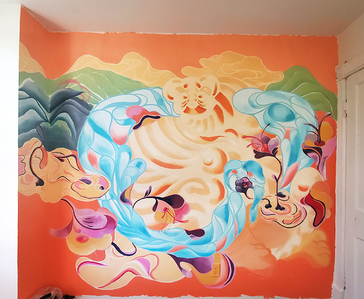 Photograph of an interior wall mural by artist Enna Kim. It features abstract and floral patterns set against an orange background.