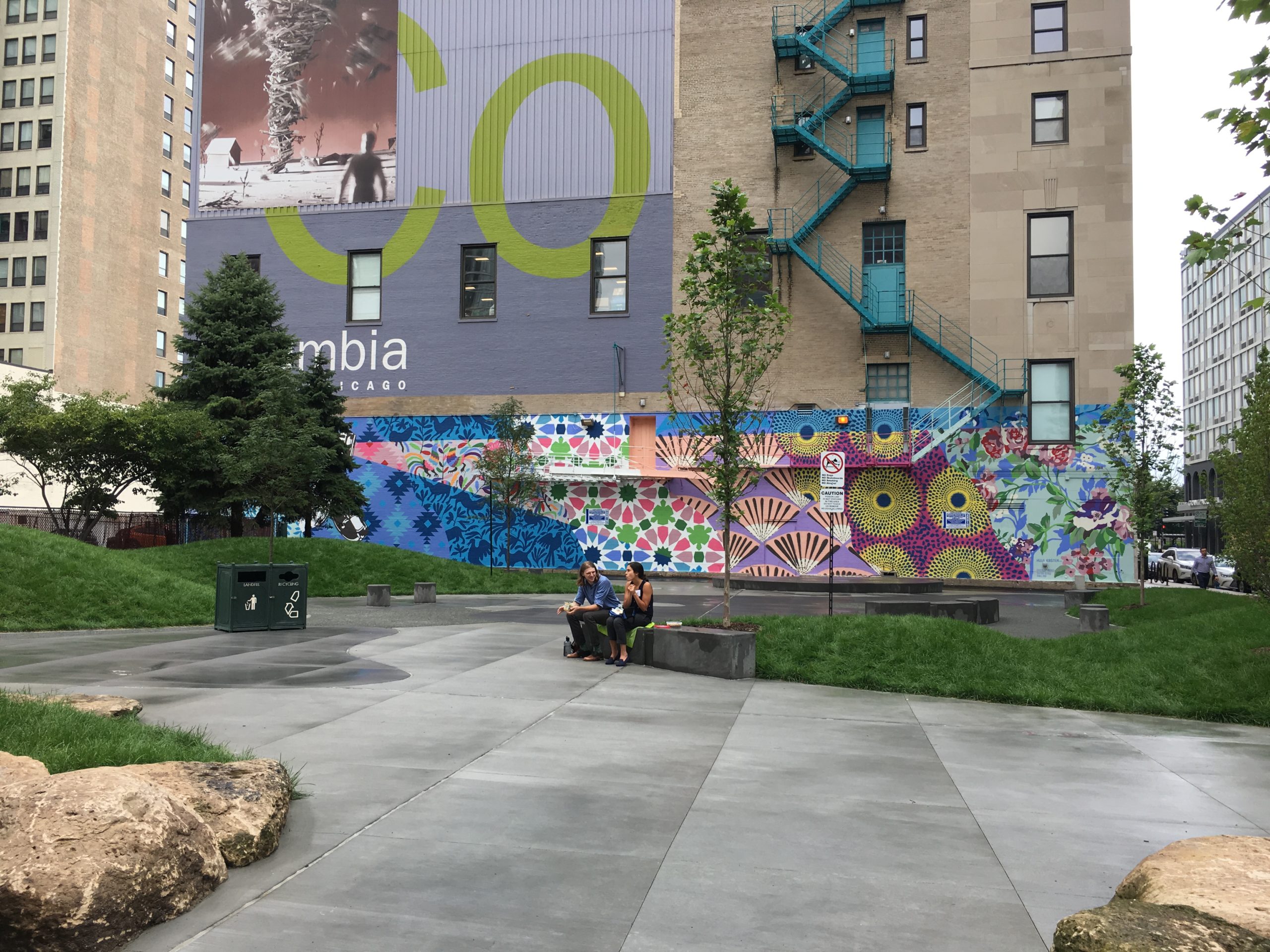 Outdoor mural on building wall picturing colourful abstract patterns