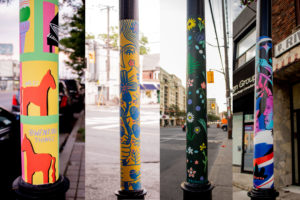 A collage of photographs of colourful street poles painted by local artists. The first pole is decorated with horses, the second and third has ornate flowers, and the fourth has images of people with geometric shapes and swirls
