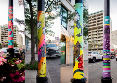 Photograph collage of colourful street poles painted by local Toronto artists. The first pole has fun, geometric shapes, the second pole has images of cups of coffee, the third is painted with birds, and the fourth pole is painted with stripes and a person
