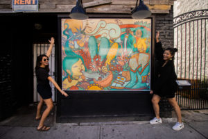 Colourful window storefront wrap by artist FP Monkey for Kensington Market BIA in Toronto