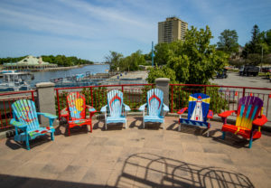 Six muskoka chairs painted by artists for I HeART Main STreet