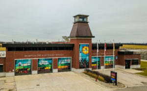 Photo of Brampton Fire Station taken from a drone, the fire station has colouful artwork on the windows.
