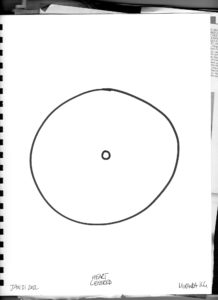 A black and white photo of a sketchbook with a black circle drawn. In the centre is a smaller black circle. The bottom of the page has the words Jan 32, 2022 and artist signature by Miranda KG for their piece "Heart Centred"