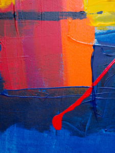 Photo of abstract painting with colours of red, orange, blue and yellow