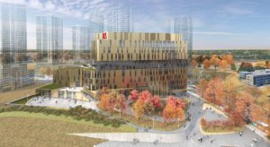Landscape mockup of the York University Markham campus with fall foliage and a blue sky.