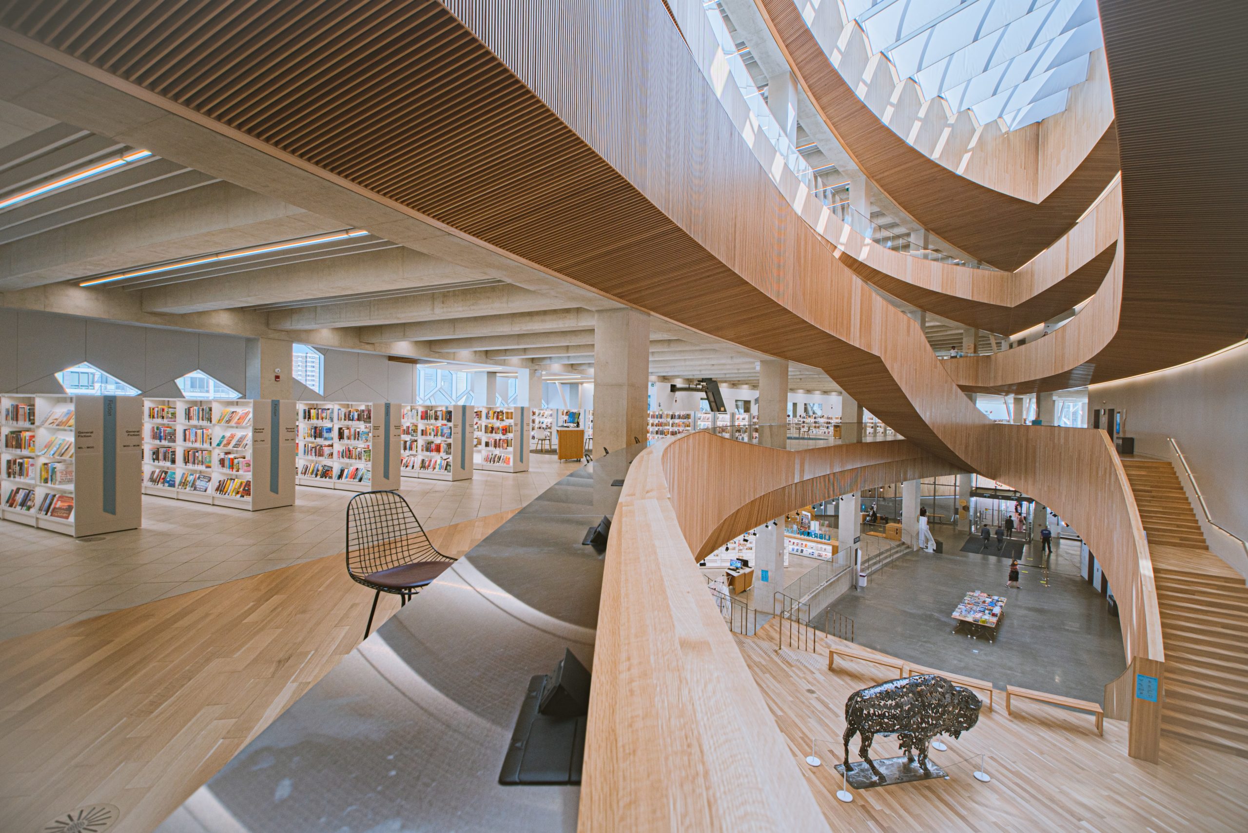Interior view of the Calgary Public Library featuring work by Lionel Peyachew. An example of Indigenous placemaking.
