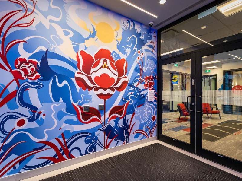 A zodiac garden mural installation in a bank foyer as part of the BMO National Mural Series by STEPS Public Art