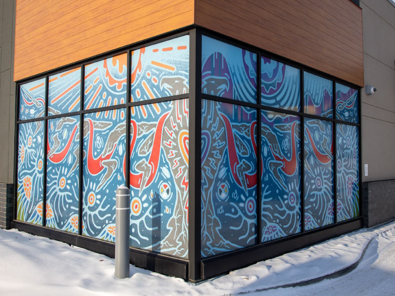 An exterior window wrapping mural by artist Jordan Strong as part of STEPS Public Art's BMO National Mural Series