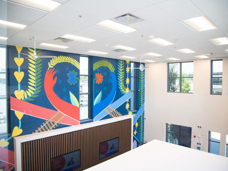 Interior mural by Caitlin McDonagh at the BMO Cloverdale Branch as part of STEPS Public Art's BMO National Mural Series