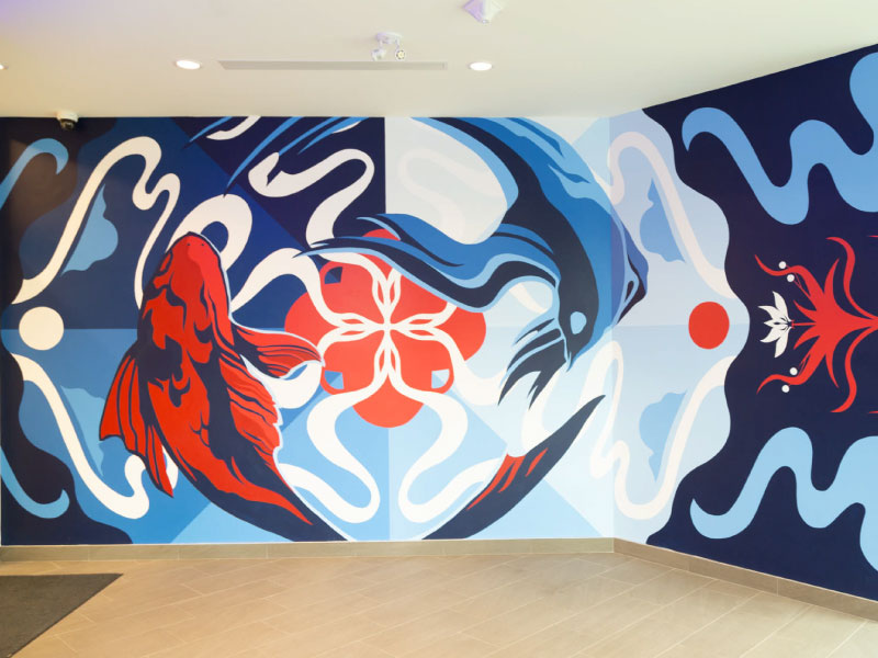 A blue red and white digital vinyl mural of koi fish swimming by artist Carolyn Wong as part of the BMO National Mural Series by STEPS Public Art