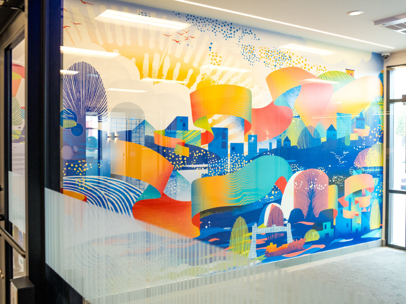 A mural by Vermillion Sands in an entrance foyer to a bank as part of the BMO National Mural Series by STEPS Public Art