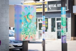 Colourful street pole wraps and painted electrical boxes in Downtown Timmins, Ontario