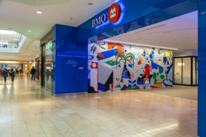 A mural inside the Square One Mall BMO bank branch by artist Adrian Forrow as part of STEPS Public Art's BMO National Mural Series