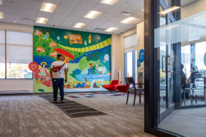 An indoor mural at a BMO bank branch in Vaughan by artist Erin McCluskey as part of STEPS Public Art's BMO National Mural Series