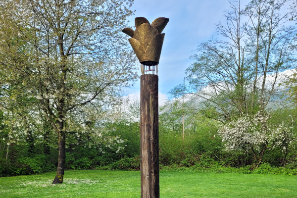 Large brass sculpture of a rain catcher by Laara Cerman in Squamish, BC