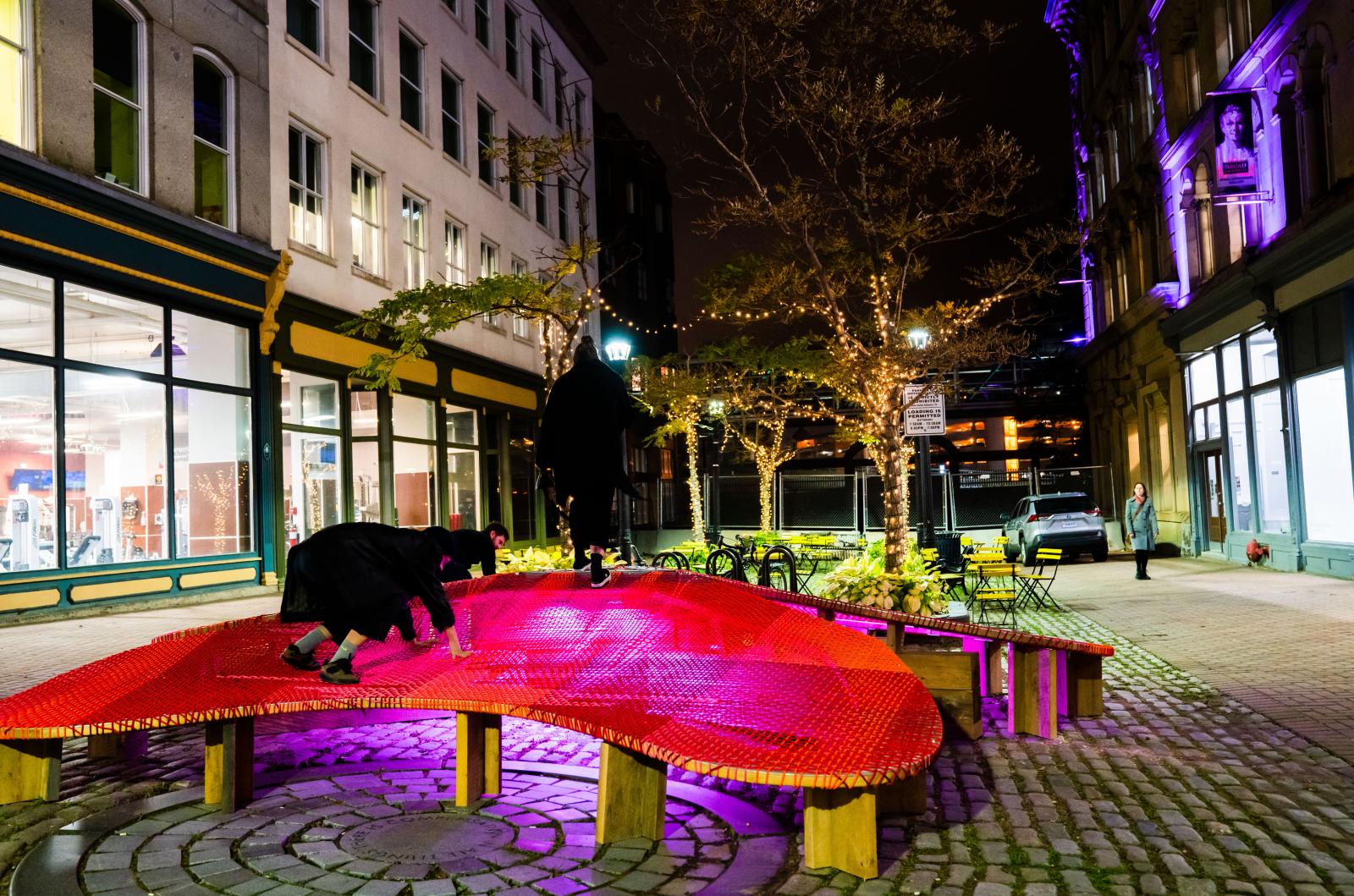 At night, visitors climb atop of The Blooming Seating’s luminous petals  in Halifax, Nova Scotia