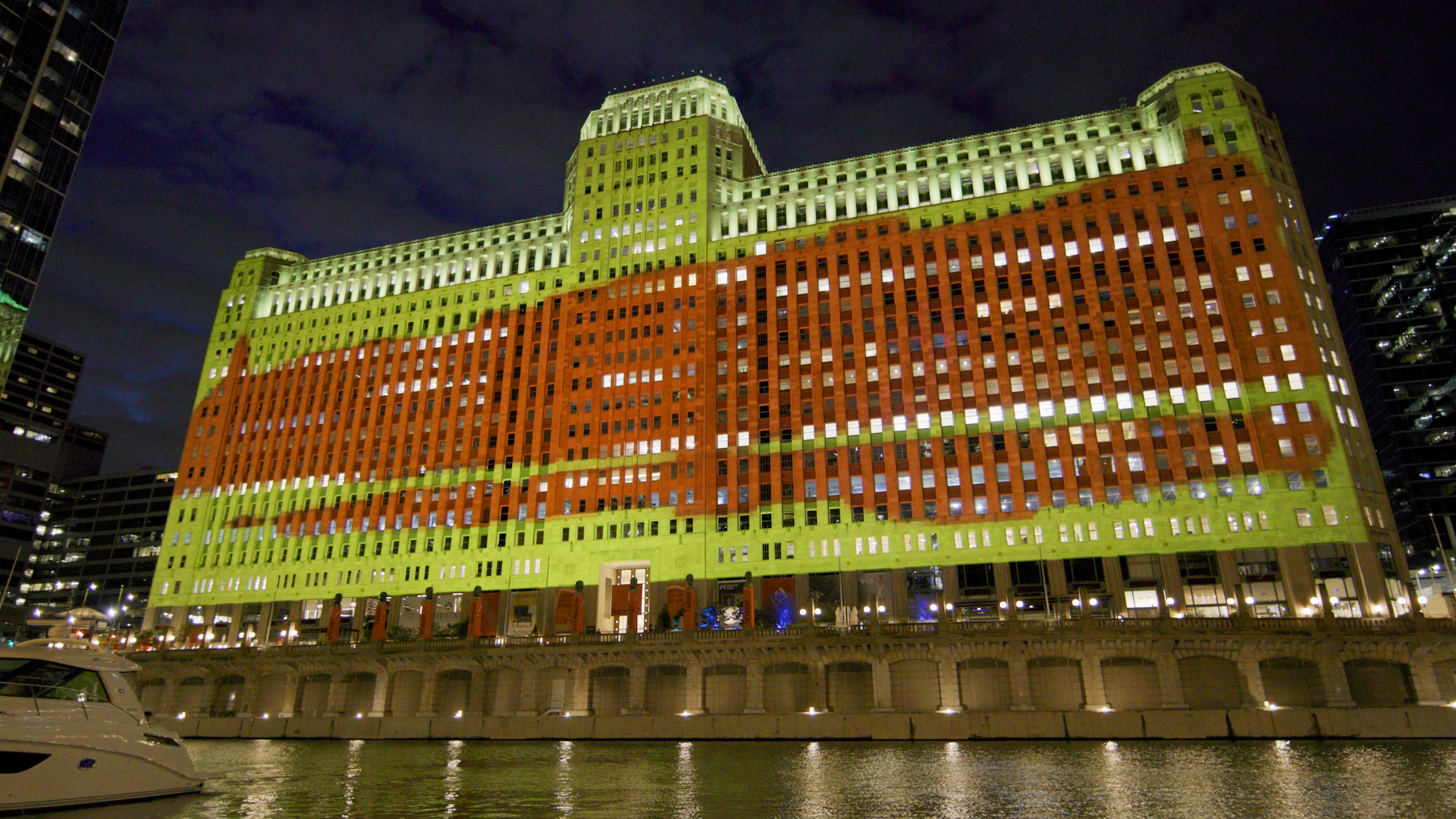 A digital art projection on Chicago's Merchandise Mart at night