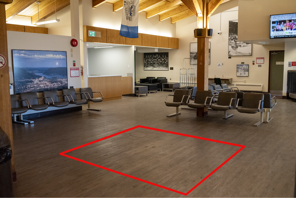 The interior and seating area by the gates of the Williams Lake Regional Airport. A red box indicates an empty location for a potential public art sculpture through the Call for Artist by Williams Lake and STEPS Public Art
