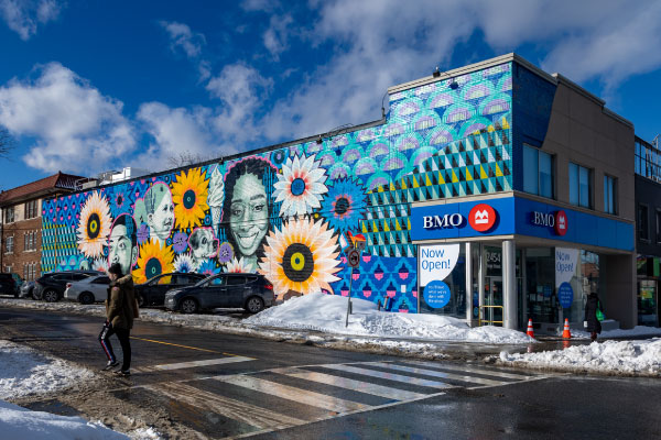 Exterior of BMO Yonge and Roselawn branch with a mural by Gosia Komorski and STEPS Public Art