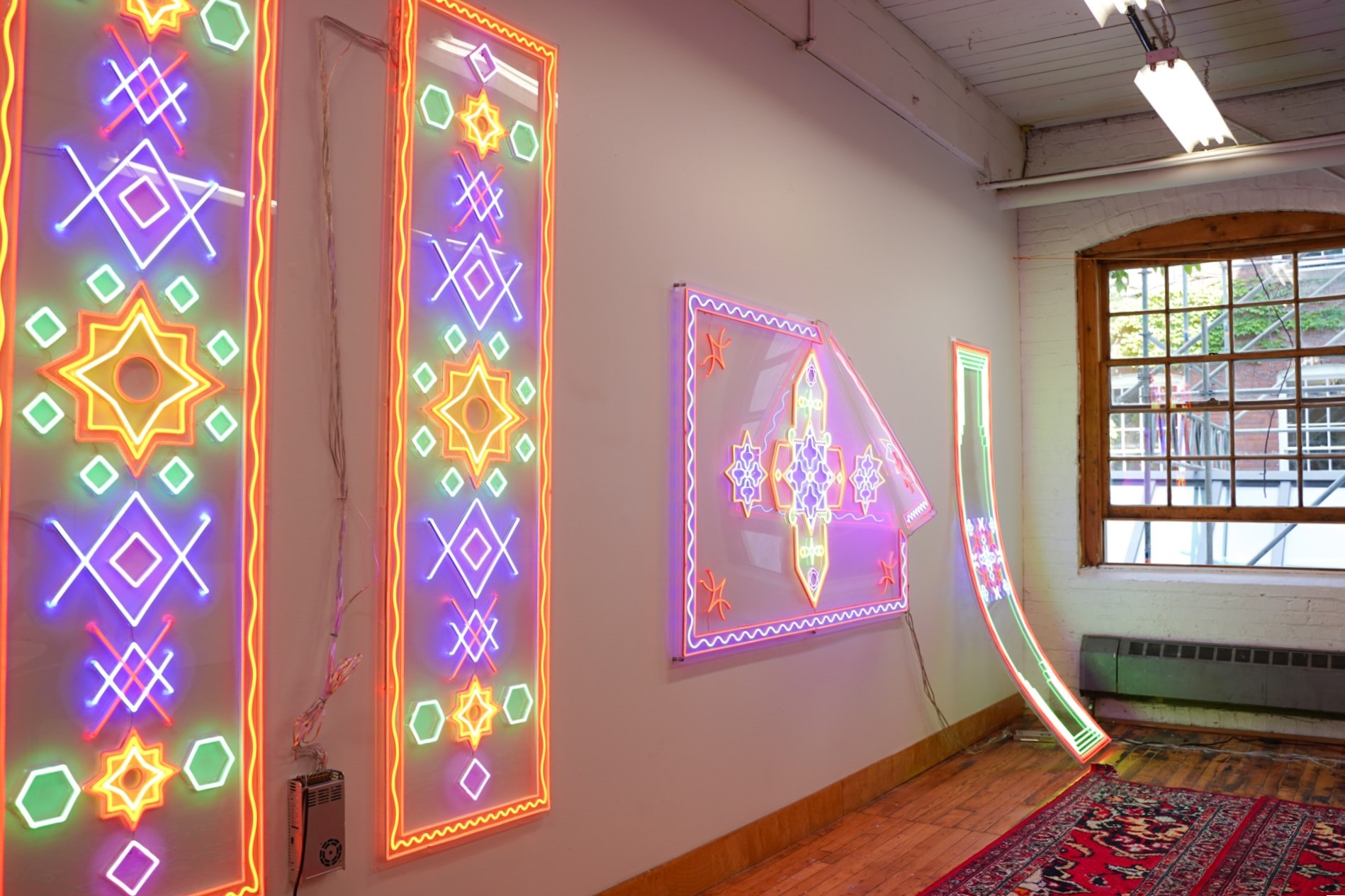 Roda Medhat's LED sculptural rugs hung up in his studio at 401 Richmond