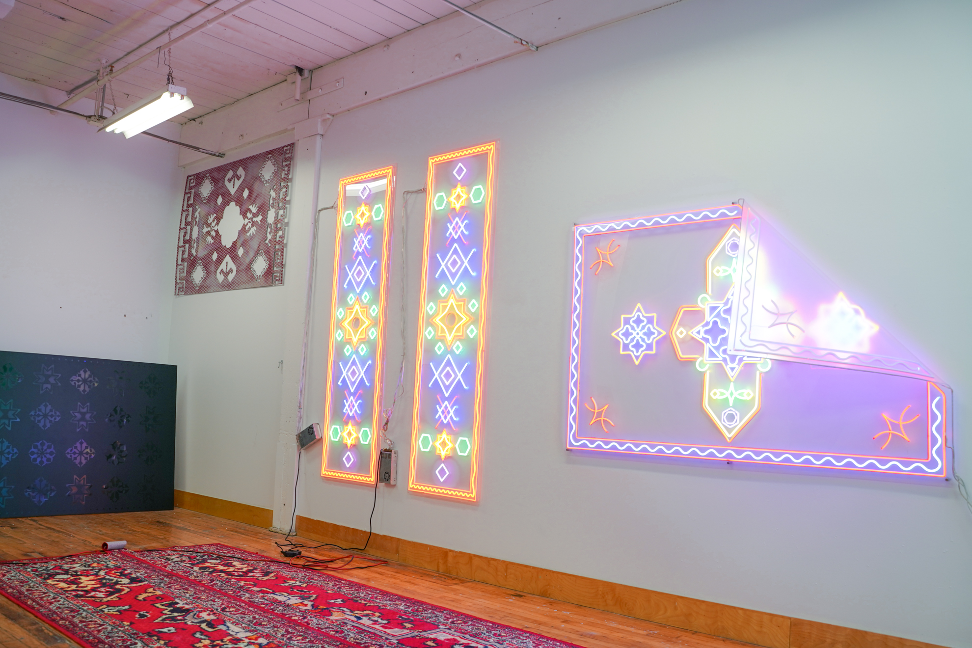 Roda Medhat's LED rug sculptures hanging in his studio at 401 Richmond in Toronto