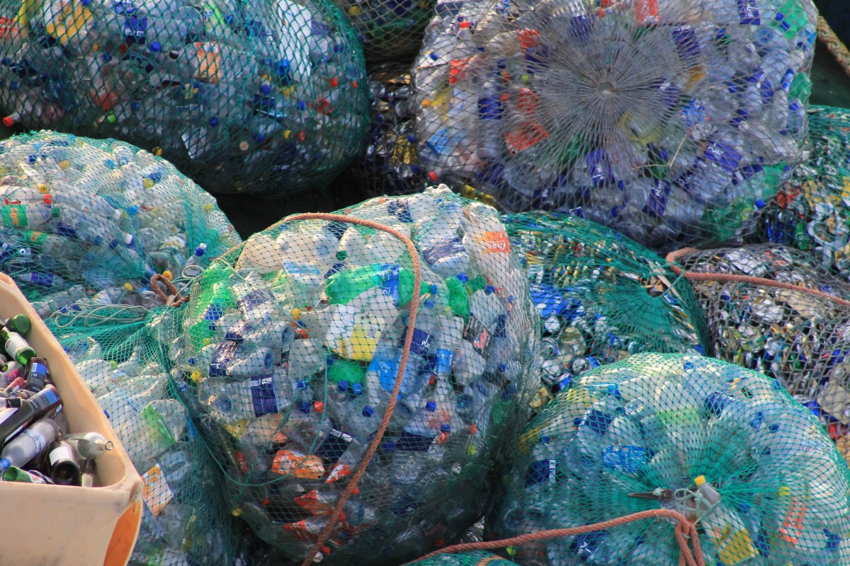 Bags of unrecycled bottles and plastic waste