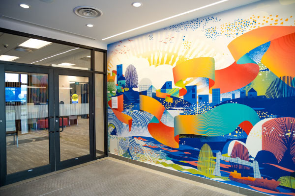 A mural in the foyer of a bank by Vermillion Sands as part of the BMO National Mural Series by STEPS Public Art